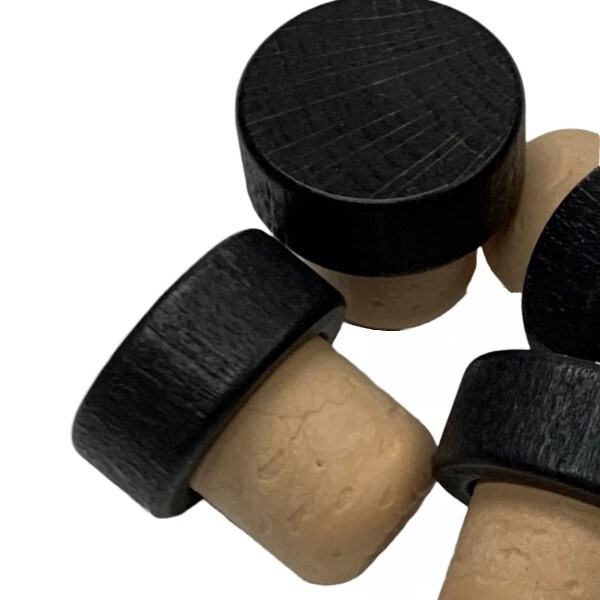 Black wood top with smooth edges and beige synthetic cork stoppers